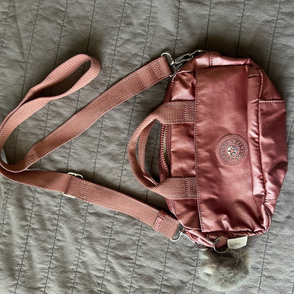 Kipling Pink Crossbody Bag with Adjustable Strap and Durable Design